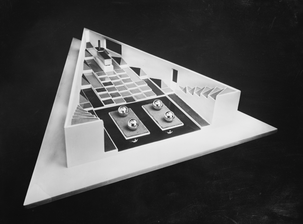 Black and white photo of a triangular model.